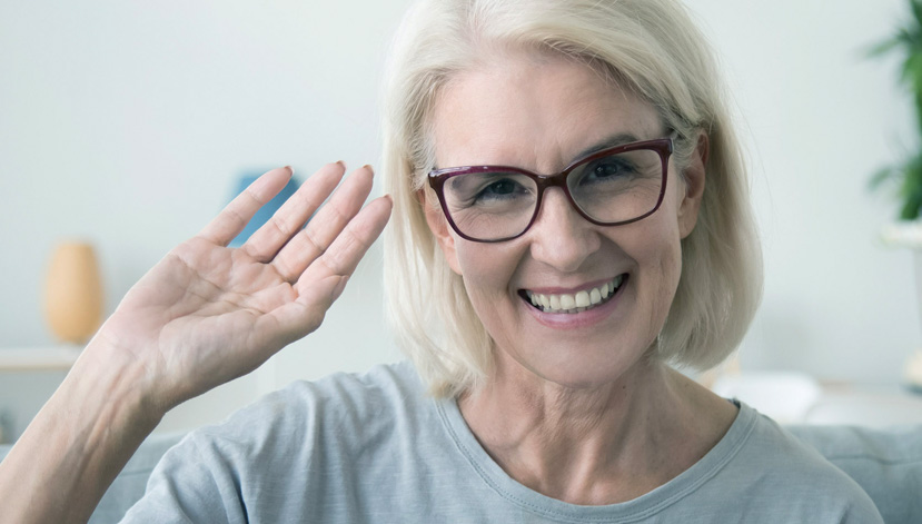 older woman waving